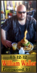 Cup Burger Challenge finisher holding their gold name plaque at Cruisin Café