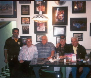 Gilbert with Bobby Allison and crew.